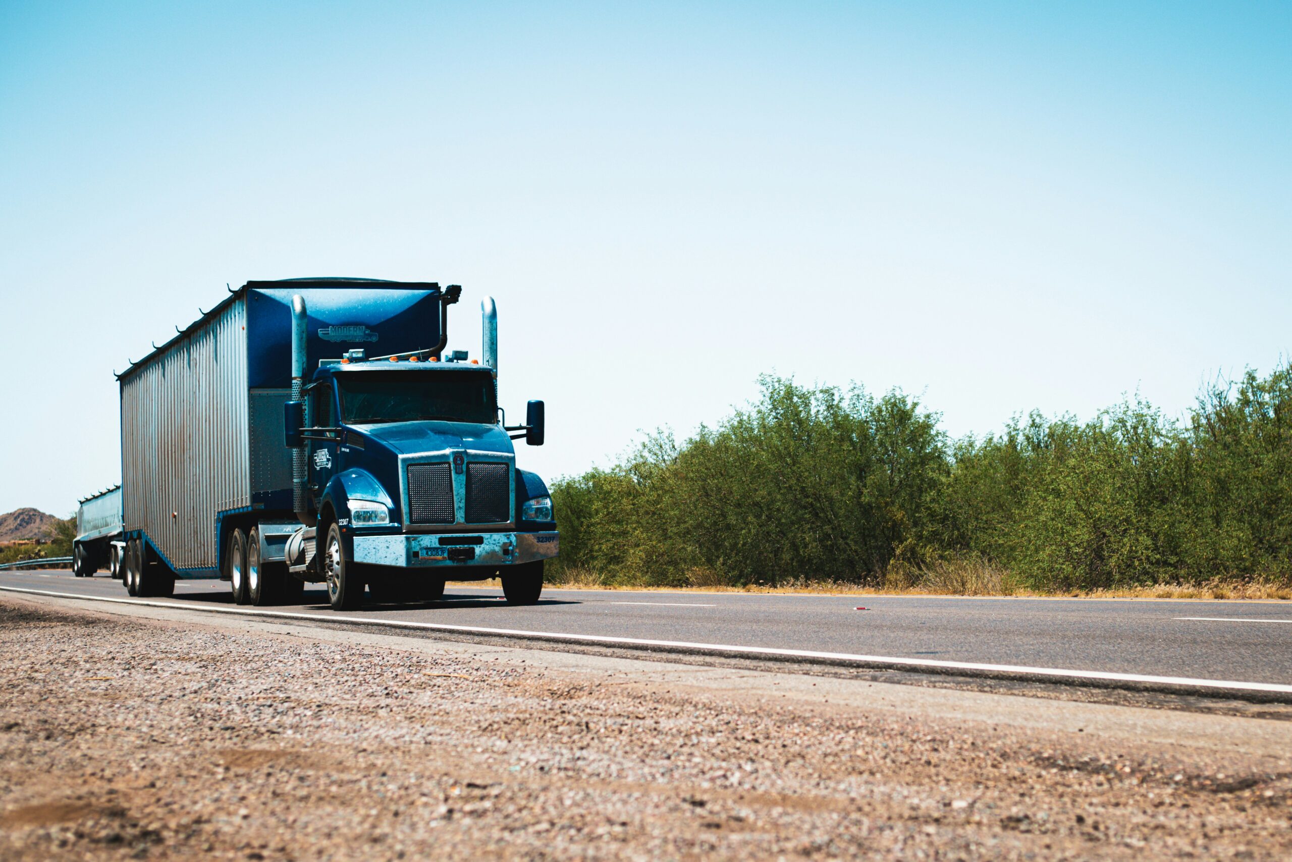 Semi truck on a road in the desert